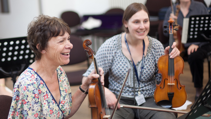 two violinists laughing undefinedtwo violinists laughing